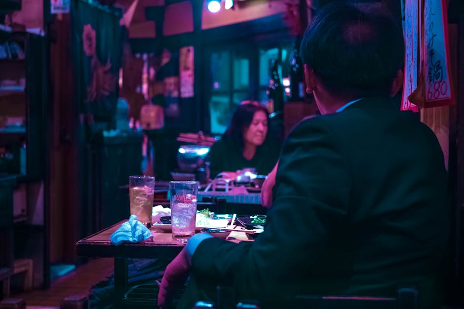 Tokyo izakaya interior with hanging red paper lanterns