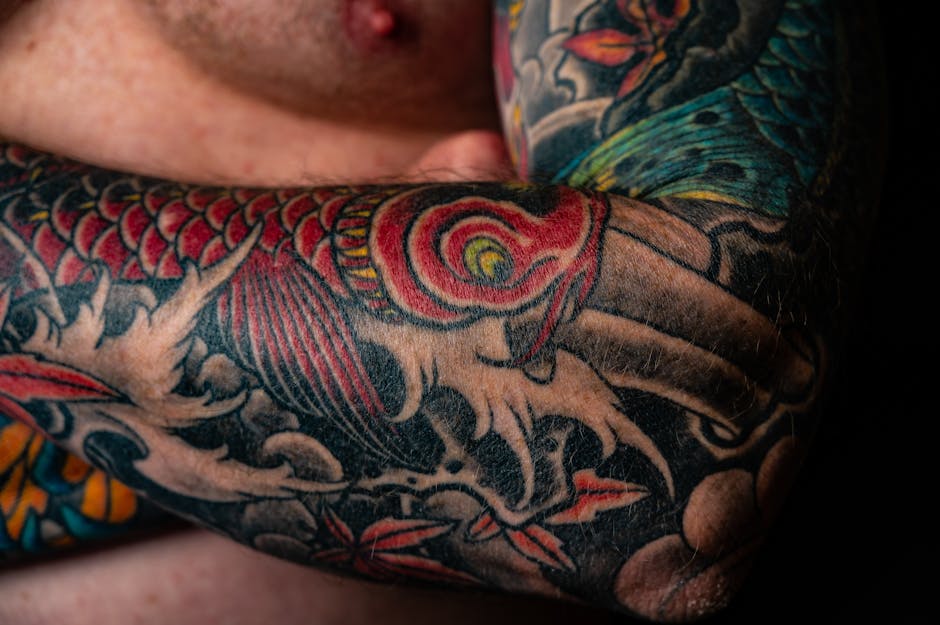 Close-up of a Japanese-style koi sleeve tattoo