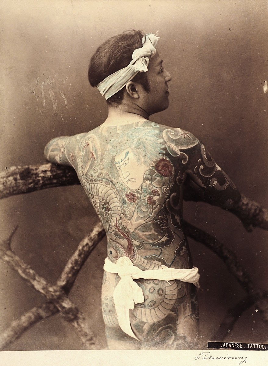 Photograph of a tattooed Japanese man with a serpent motif, 1880-1890