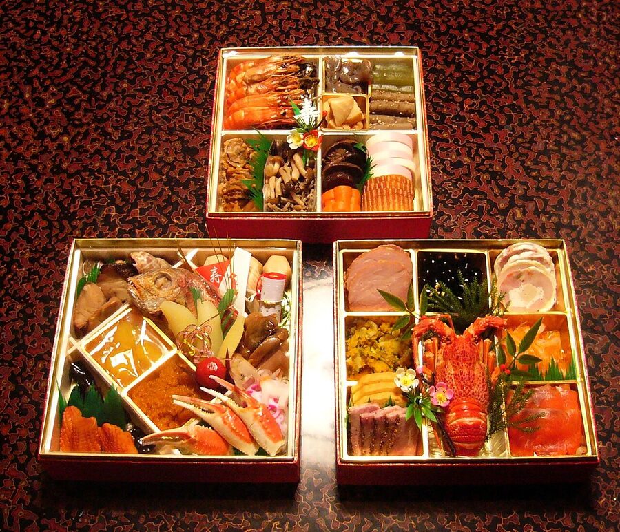 Japanese osechi ryōri in stacked jūbako boxes — traditional New Year preserved foods