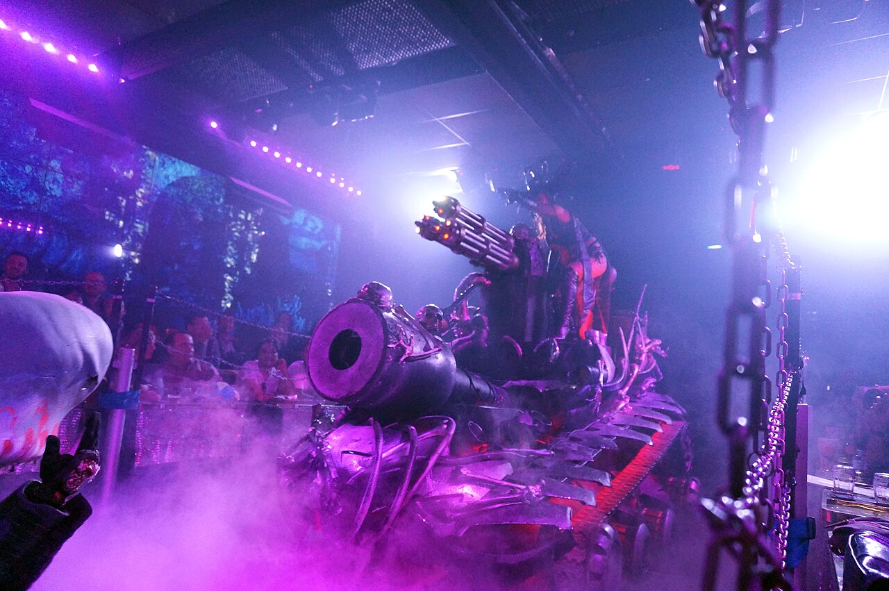 Full stage view of a Robot Restaurant show with performers and mechanical props