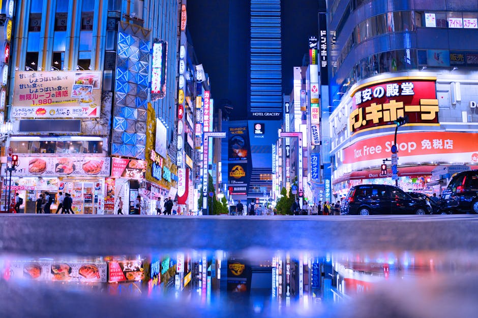 Bright neon streets of Shinjuku Kabukicho at night with people walking