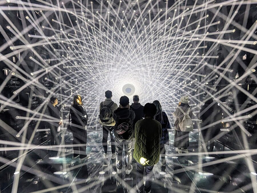 Visitors immersed in the Light Sculpture installation at teamLab Borderless, Azabudai Hills, 2024