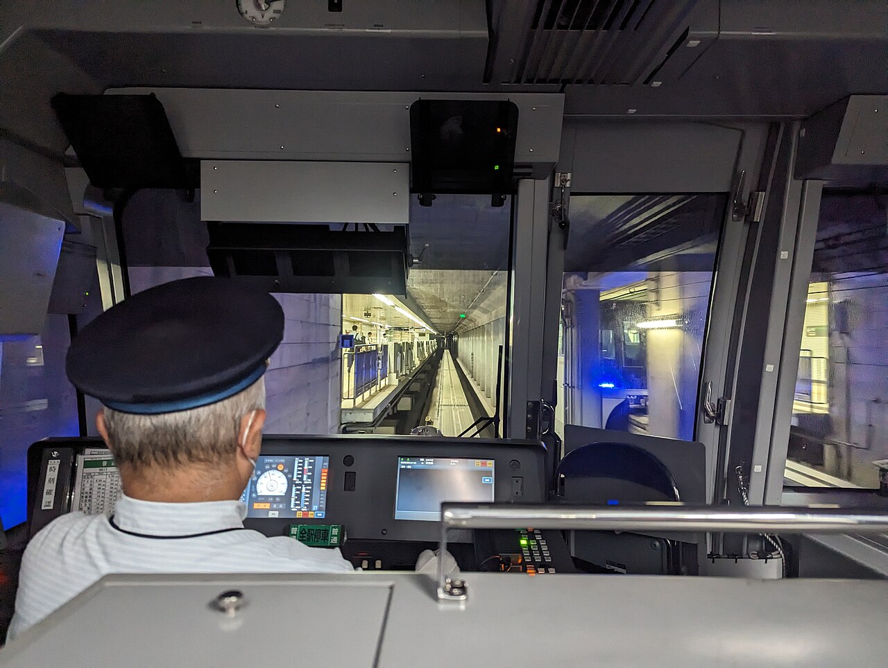 Interior view of Tokyo Monorail approaching Haneda Airport