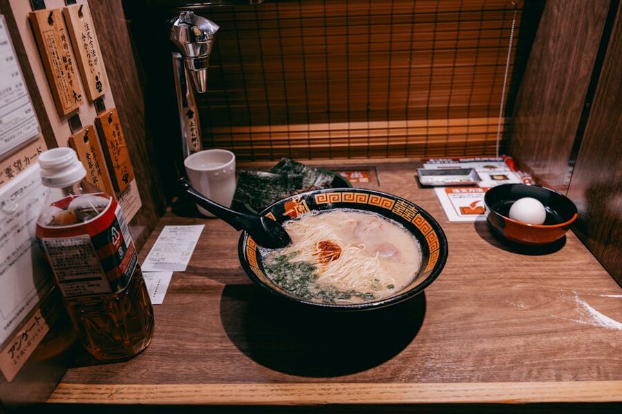 A steaming bowl of ramen served in a private dining booth in Tokyo, Japan