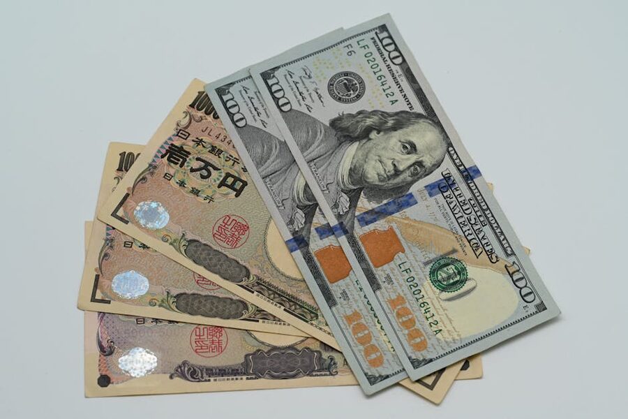 Close-up of US dollar bills and Japanese yen banknotes representing currency exchange