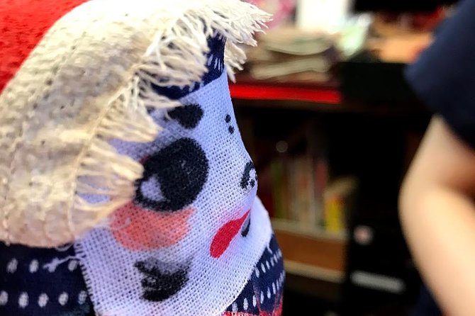 Deep Dive into the World of Daruma Dolls - Tea, games, and daruma senbei while the glue dries