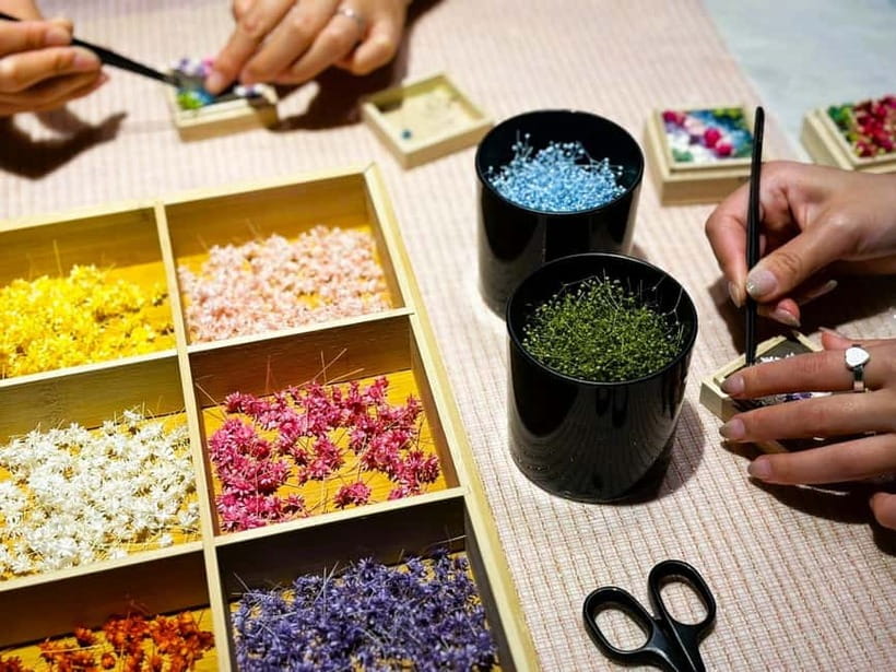 Experience Crafting a Flower-Adorned Mini Japanese Garden - Arranging preserved and dried flowers inside the box