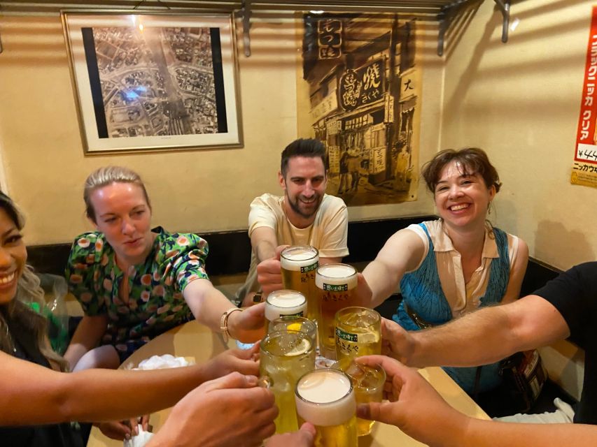 Shinjuku: bar hopping night tour at Japanese Izakaya - Walking through Kabukicho after dark