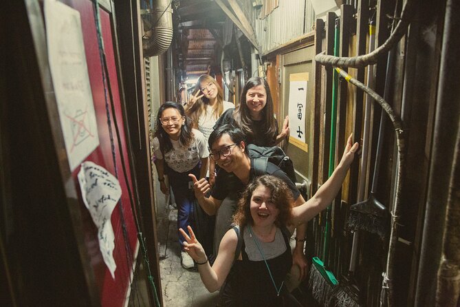 Shinjuku Izakaya and Golden Gai Bar Hopping Tour - Walking through Kabukicho’s neon streets