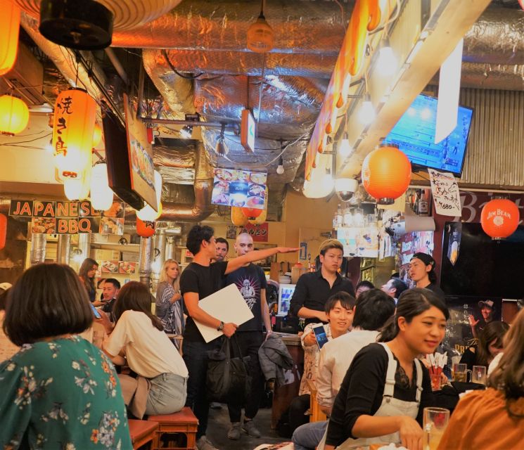 Tokyo: Bar Hopping Tour in Shibuya - Starting beneath the SHIBUYA TSUTAYA sign