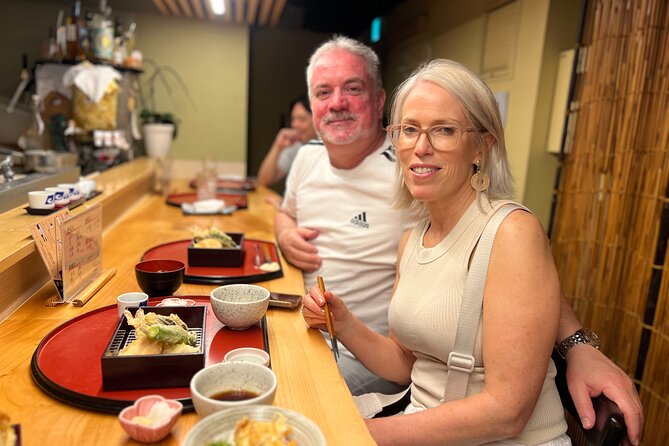 Tokyo: Best Ginza Food Tour at 3 Local Eateries - Ginza at 6 p.m., polished streets and traditional food