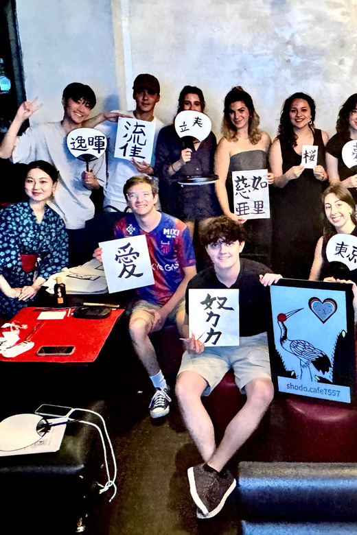 Tokyo: Calligraphy on Kanji Fan & Scroll with Drink - The hanko stamp and the bundle of souvenirs