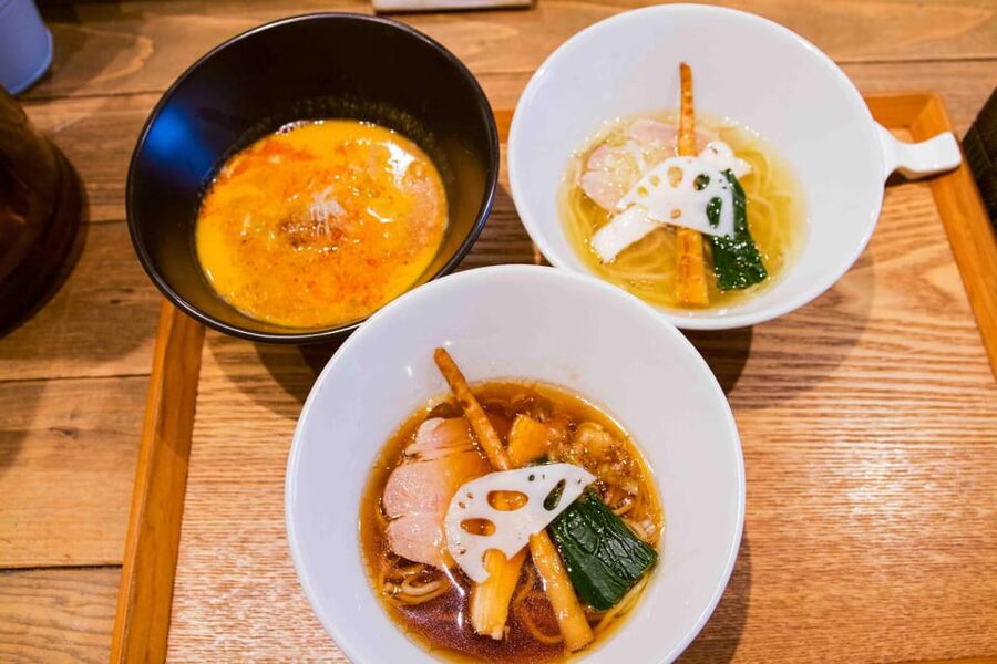 Tokyo: Ramen Tasting Tour with 6 Mini Bowls of Ramen - Walking through Tokyo between bowls