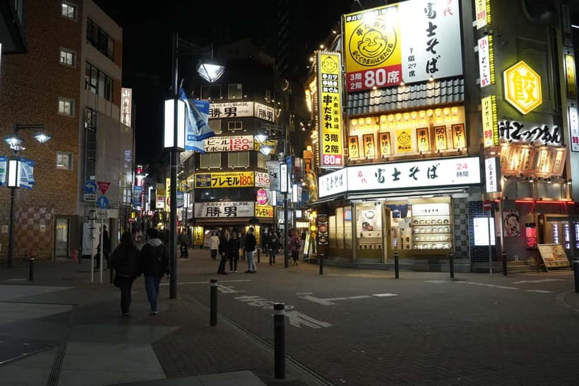Tokyo: Shibuya Food Tour, Neon Lights & Local Flavors - Don Quijote, the useful chaos of Japanese shopping