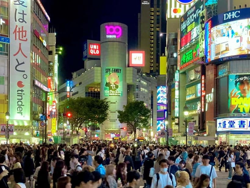 Tokyo: Shibuya Night Walking Tour with a Local Expert - Crossing Shibuya beneath the city lights