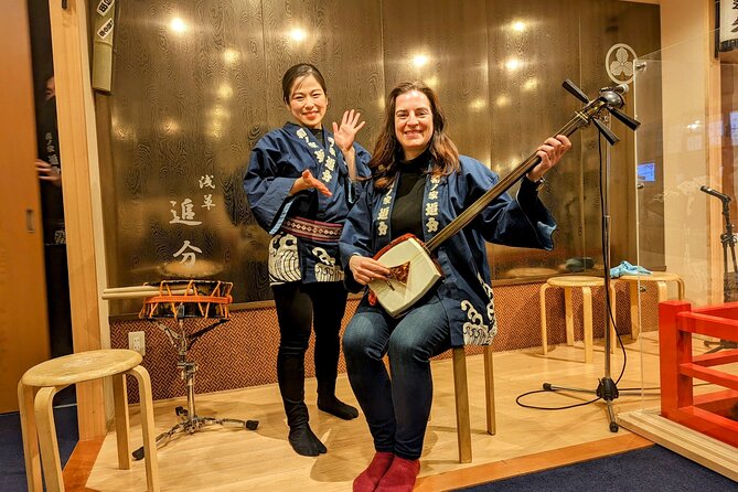 Tsugaru shamisen performance over traditional dinner - A close-up Tsugaru-shamisen performance